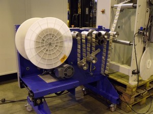 Moving roll spool for welding web