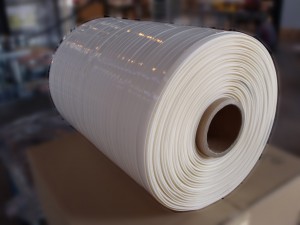 Spool of adhesive foam - Web width :  5 to 15 mm